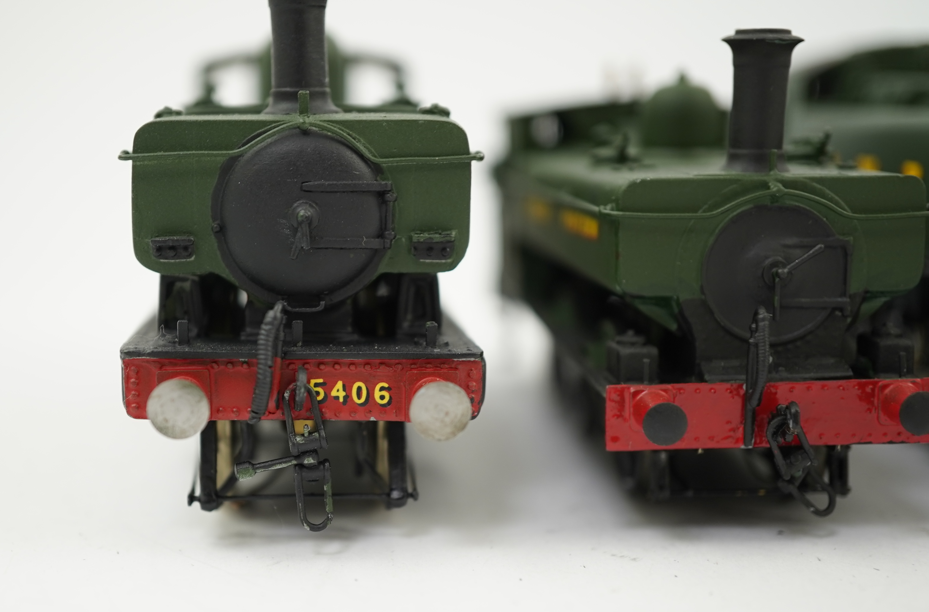Three 00 gauge brass and white metal kit built GWR tank locomotives; a 15xx class 0-6-0T, 1500, together with an 54xx class 0-6-0PT, 5406, and a 19xx class 0-6-0PT, 1925, all constructed, painted and lined to a high stan